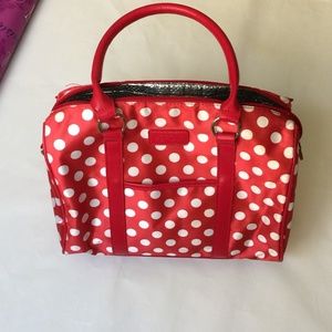 red polka dot luggage